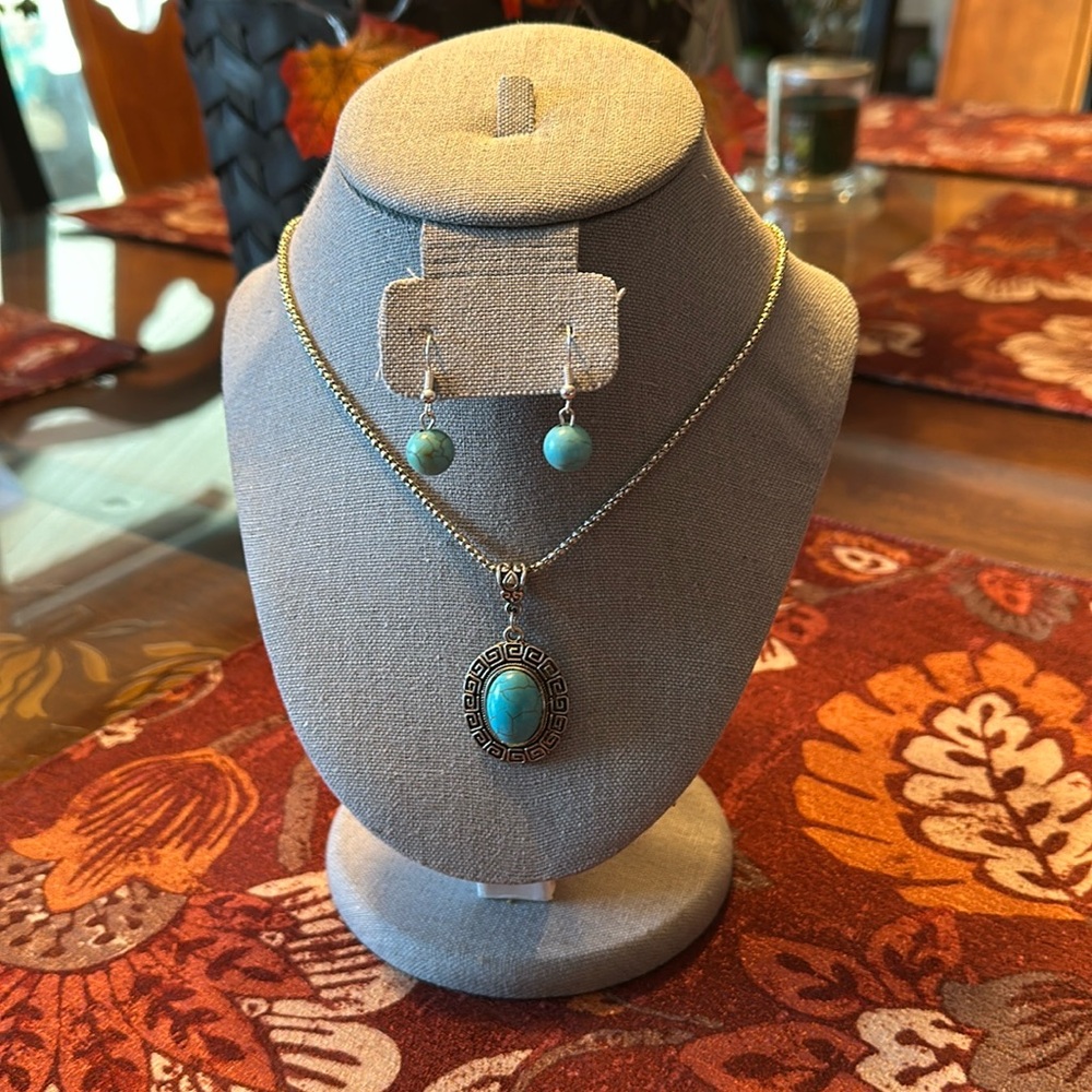 Aqua and silver pendant necklace with two pairs of matching earrings